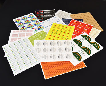Labels on A4 sheets printed full colour with various artworks
